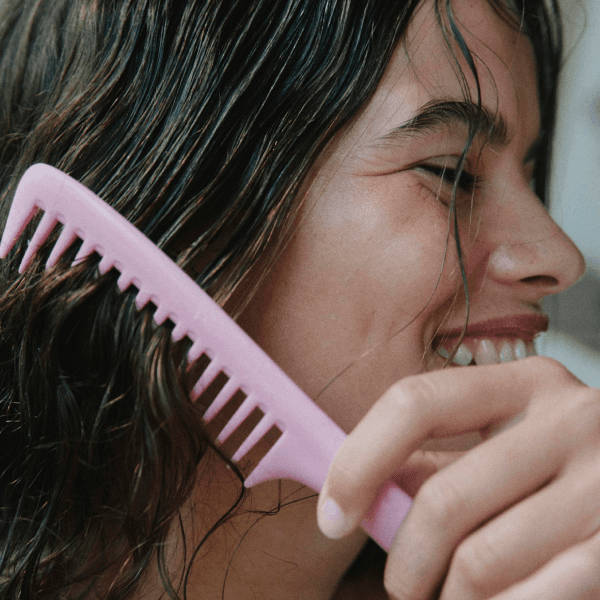 Girl combing her hair